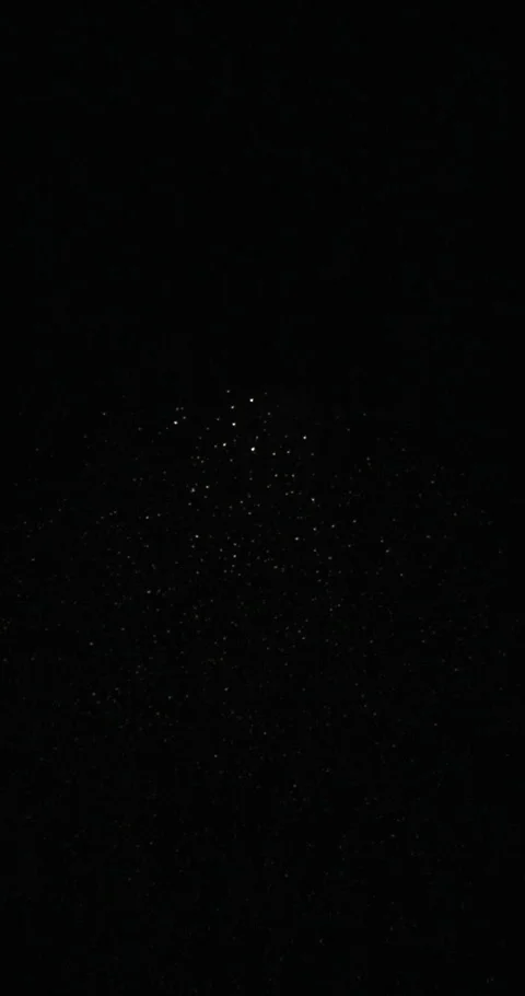 Snow falling under street lamp with copy space on black background, slow motion Stock Footage 327663081