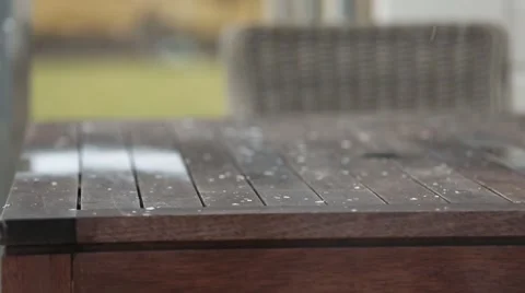 Snow falling on Wooden table Stock Footage 52360842