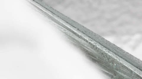 Snow falling,macro snowflakes falling on the window,close up shot Stock Footage 34449478