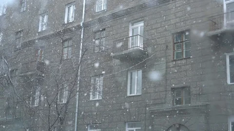 Snow falls on the background of a house 库存影片 88638972