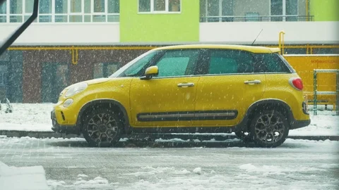 Snow falls on the car Stock Footage 83247574