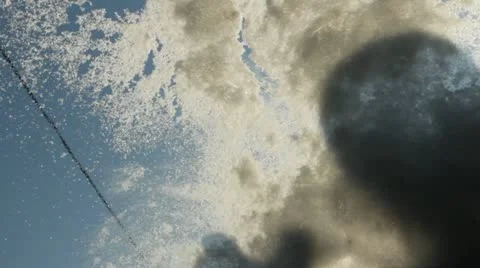 Snow falls (to cover, throw) on windscreen wipers car Stock Footage 22120516