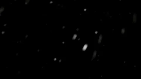 Snow falls on a dark background Stock Footage 72775991