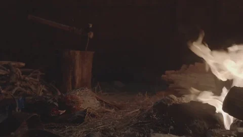 Snow falls over camp fire Video stock 74749413