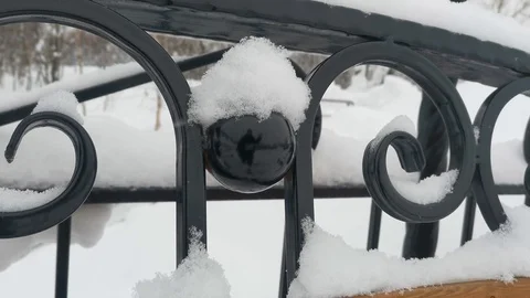 Snow falls on a Park bench Stock Footage 124405850