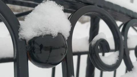 Snow falls on a Park bench Stock Footage 124405925