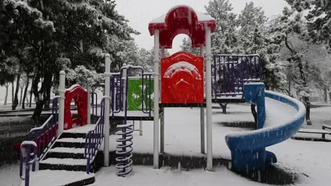 Snow Falls On The Playground 2 Stock Footage 225839597