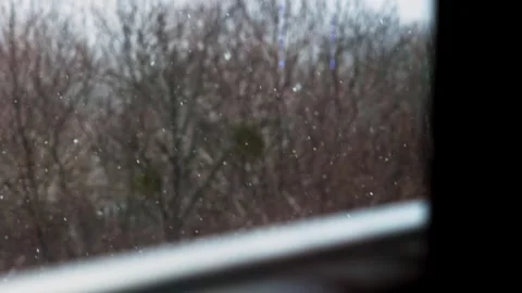 Snow falls. Winter landscape through the window in the house. Stock Footage 270566431