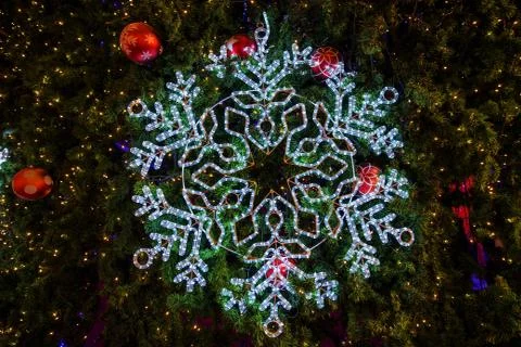 Snow flake on Christmas tree Stock Photos