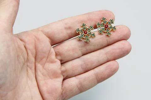 Snow Flake Enamel Stud Earrings, Red Sparkling Rhinestone, Gold Tone Metal Stock Photos