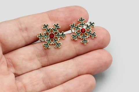 Snow Flake Enamel Stud Earrings, Red Sparkling Rhinestone, Gold Tone Metal Stock Photos