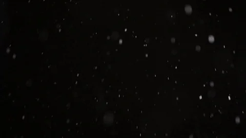 Snow flakes in the black sky fall from above Video stock 126350226