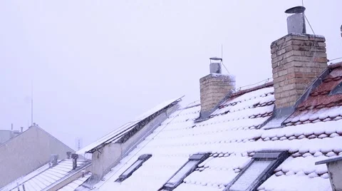 Snow flakes falling down on the roof Stock Footage 60390769