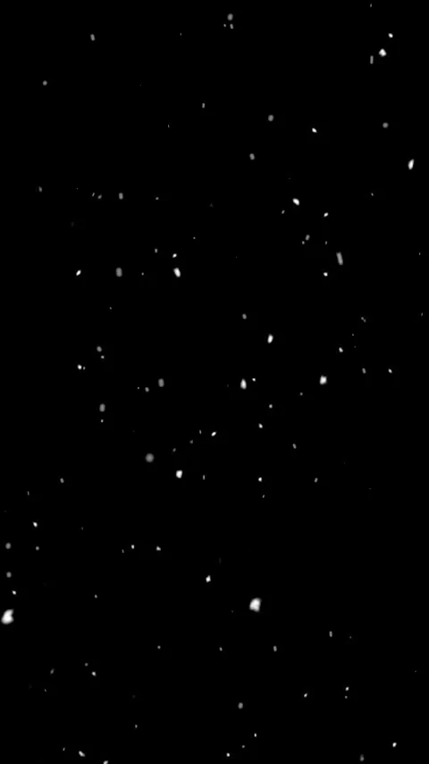 Snow flakes overlay, black background. Winter, slowly falling snow effect Video stock 285029489