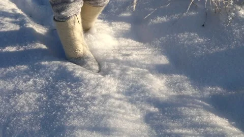 Snow flies from under boots. Slow motion of sparkling snow Stock Footage 145277002