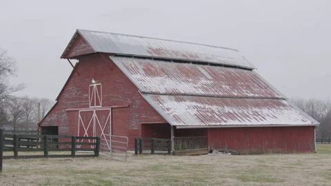 Snow Flutters at a Red Barn in Winter Stock Footage 297132507