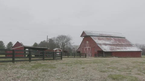 Snow Flutters at a Red Barn in Winter Stock Footage 297134085