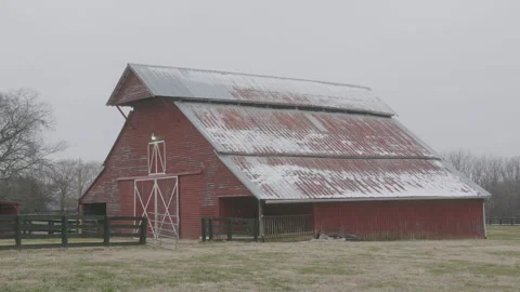 Snow Flutters at a Red Barn in Winter Stock Footage 297140815