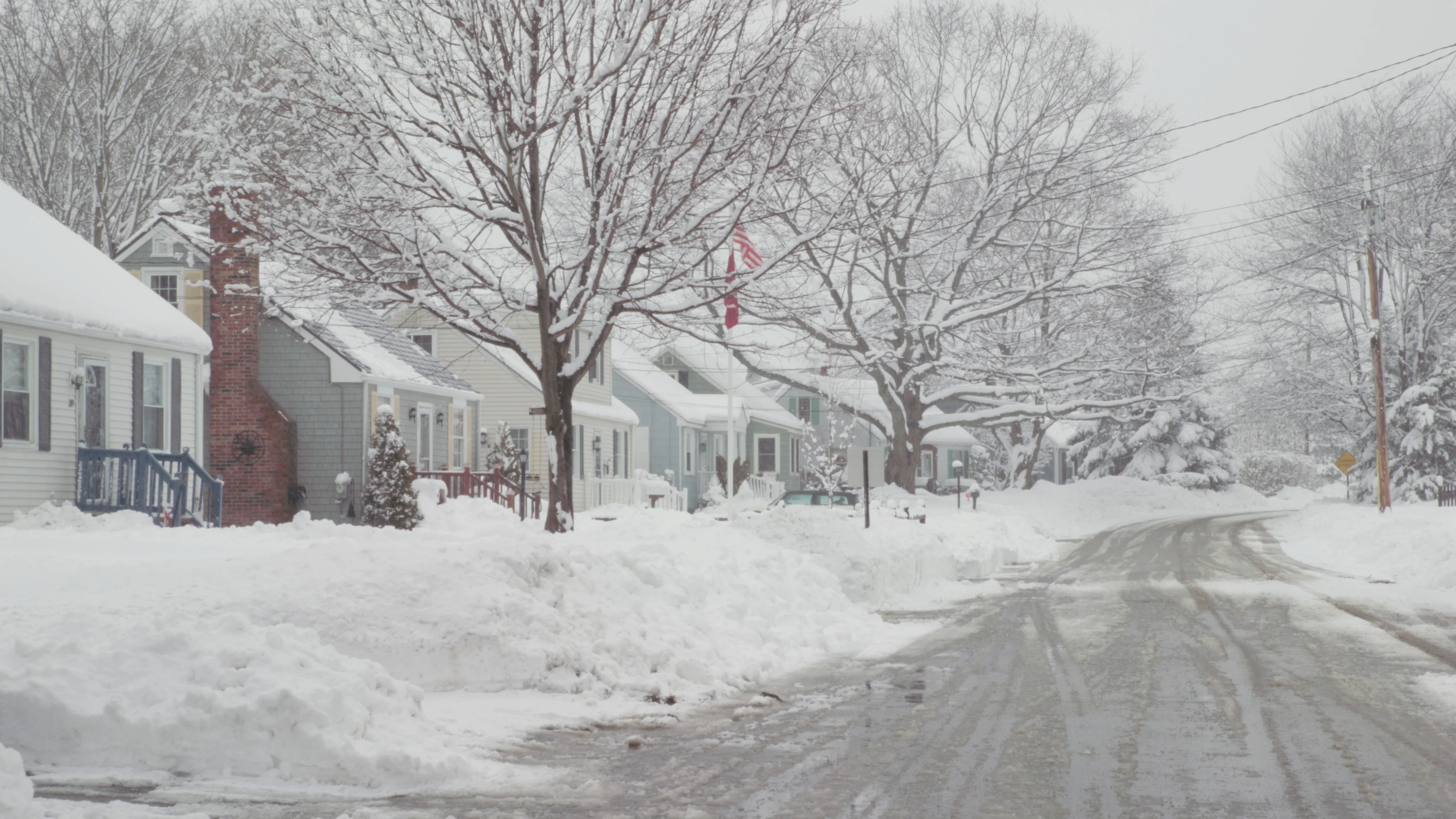 Snow flying on row of houses