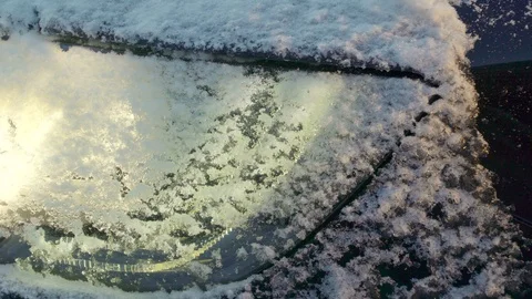 Snow on the front of the headlight of the car Stock Footage 102398610