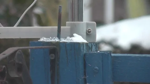 Snow gathering on top of post with attachments Stock Footage 92481527