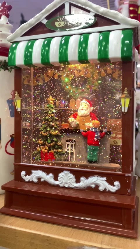 The Snow Globe with beautiful house model santa clause and Christmas tree inside Stock Footage 166559380