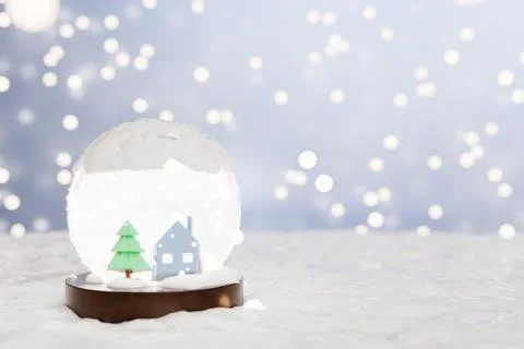 Snow globe featuring a house and tree Illustrazione stock