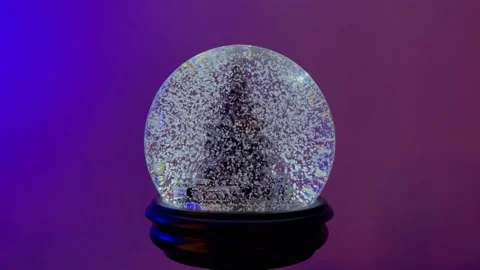 Snow Globe im Middel with Blue Purple Backdrop Stock Footage 144967771