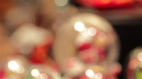 Snow Globe Pull Focus - German Christmas Toy Market Stall Twinkling Xmas Lights Stock-Footage 44514809