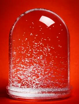Snow globe on red background Stock Photos