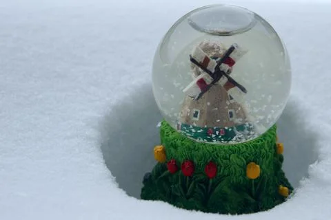 Snow globe in a snow drift Stock Photos