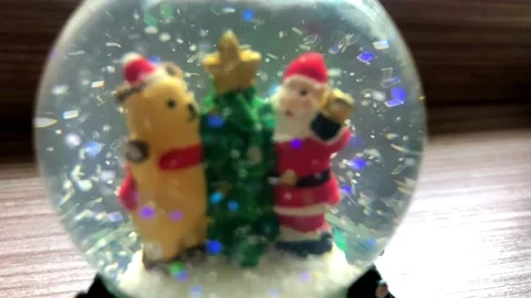 A snow globe with snowman on background spruce branches with snow2 Stock Footage 152388345