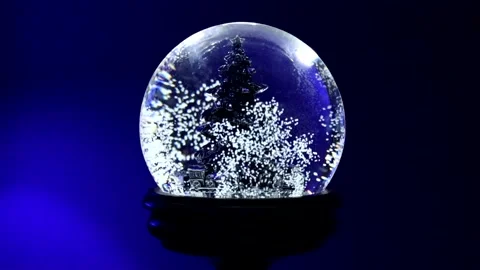Snow Globe with Tree Starting Up in Slow Motion Stock Footage 144968260