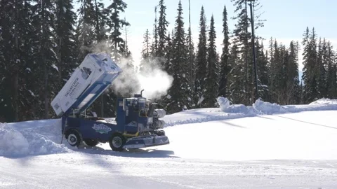 Snow Grooming Machine Preparing Ski Slope in Sunny Day Stock Footage 263184853