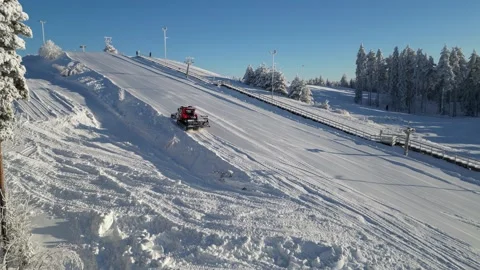 Snow grooming machine preparing small ski slope in Kempele, Finland Stock Footage 328500515