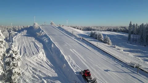 Snow grooming machine preparing small ski slope in Kempele, Finland Stock Footage 328500570