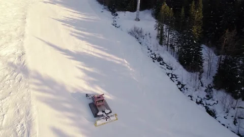 Snow grooming machine, snow maker, mountain sunset, snow, high alpine, snowy Stock Footage 238614380