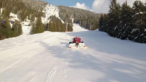 Snow grooming machine, snow maker, mountain sunset, snow, high alpine, snowy Stock Footage 254511671
