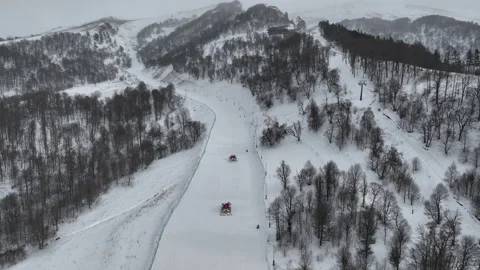 Snow grooming machines preparing the ski runs in Bakuriani Stock-Footage 327452945