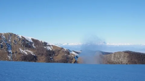 Snow gun (snow cannon) making artificial snow on the slopes Stock Footage 100844187