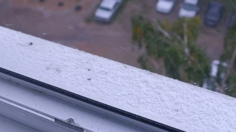 Snow hail falls on the windowsill view from the apartment window. Stock Footage 123559123