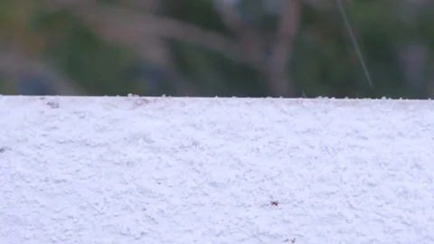 Snow hail falls on the windowsill view from the apartment window, closeup view. Stock Footage 123559175
