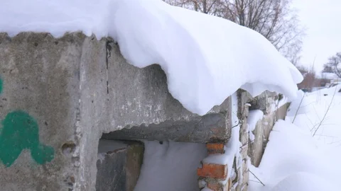 Snow hangs dangerously. Possible descent or collapse of snow. A slew of snow. Stock Footage 102331829
