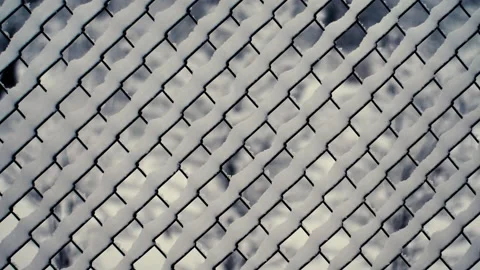 Snow has fallen on the fence by the side of the road. Stock Footage 232288216