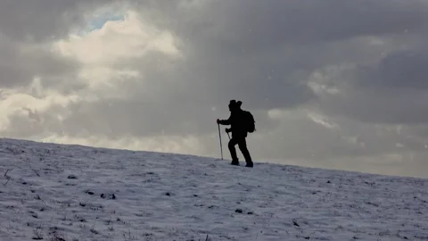 Snow Hiking In Blizzard Man 스톡 동영상 220736274