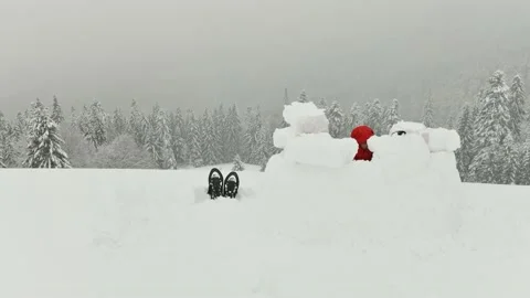 Snow igloo building in the high winter mountains Stock Footage 157556483