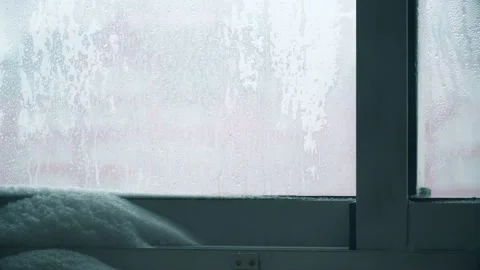 Snow on the inside window Stock Footage 148533376