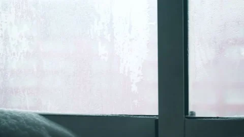 Snow on the inside window Stock Footage 148533384