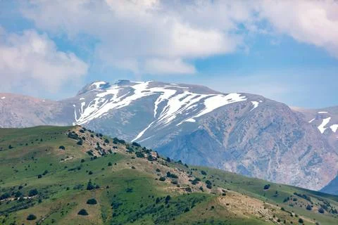 Snow lines mark distant mountain peaks Stock Photos