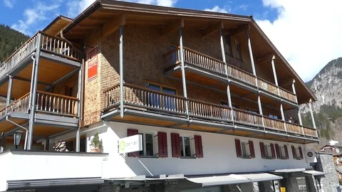 SNOW LODGE WITH MOUNTAIN Stock Footage 121450530